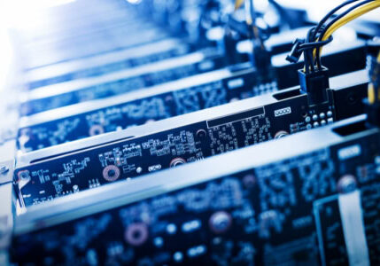 Close-up of server motherboard circuits and cables in data center rack